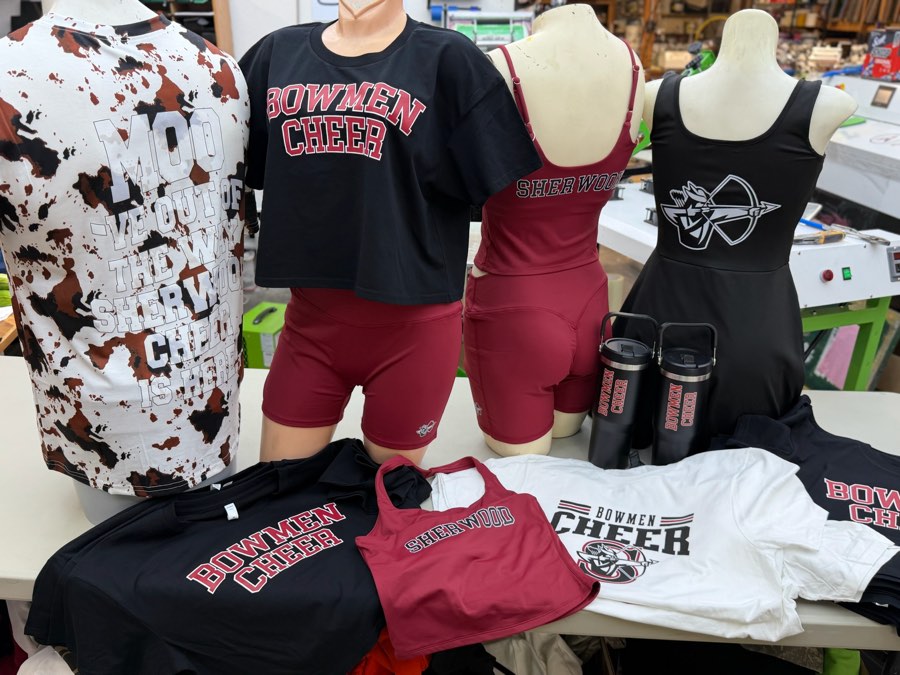 Bowmen Cheer tees, crop tops, shorts, tanks and tumblers displayed on mannequins