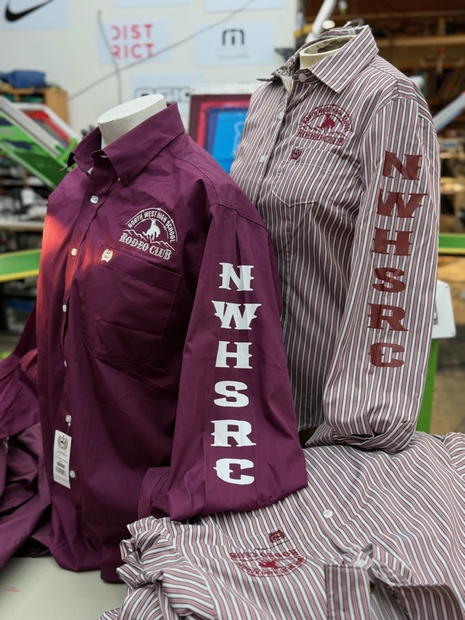 Maroon and striped western button-up shirts with an embroidered chest logo and NWHSRC down the sleeve