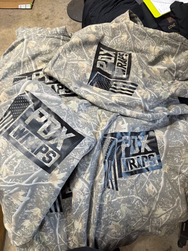 Light camo hoodies printed with the PDX Wraps flag logo